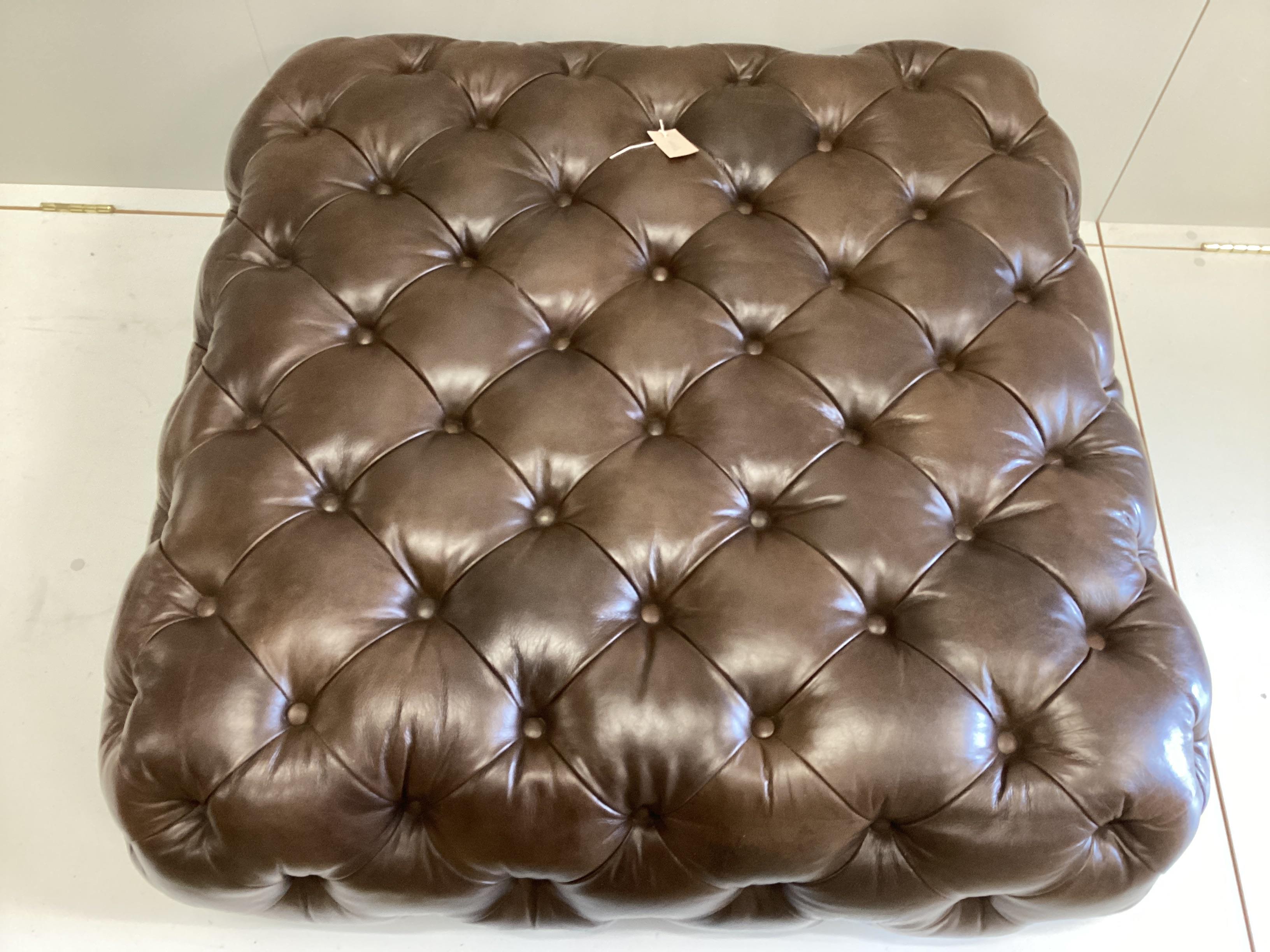 A large contemporary Victorian style buttoned brown leather footstool, originally retailed by Cox & Cox, width 104cm, depth 100cm, height 38cm